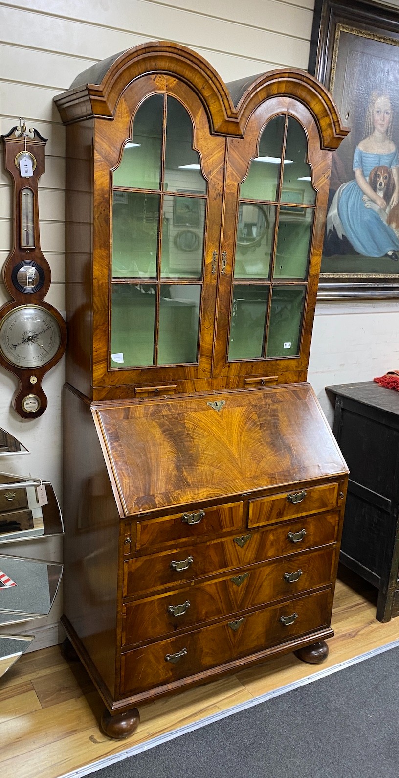 A George I style banded walnut double domed bureau bookcase, width 92cm, depth 55cm, height 214cm